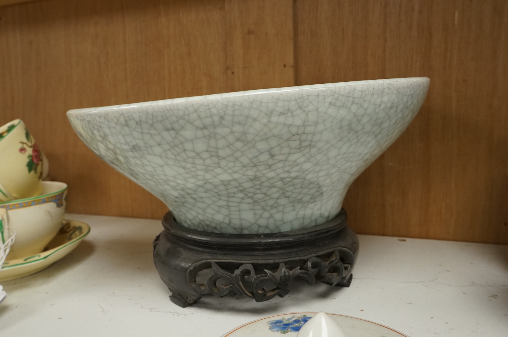 Oriental items to include a crackleglaze bowl on stand and a bamboo brush pot, together with two other vessels, largest 27cm in diameter